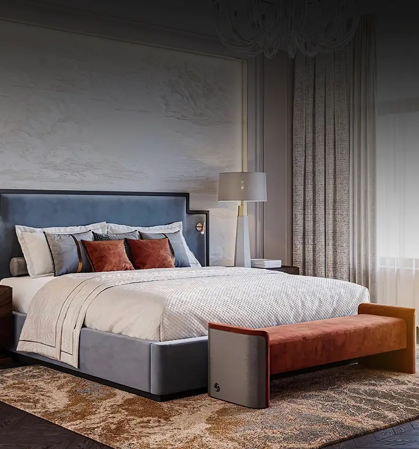 A modern bedroom with a large upholstered bed, layered pillows, a brown bench at the foot, floor lamp, and tall curtains, featuring neutral and earthy tones.